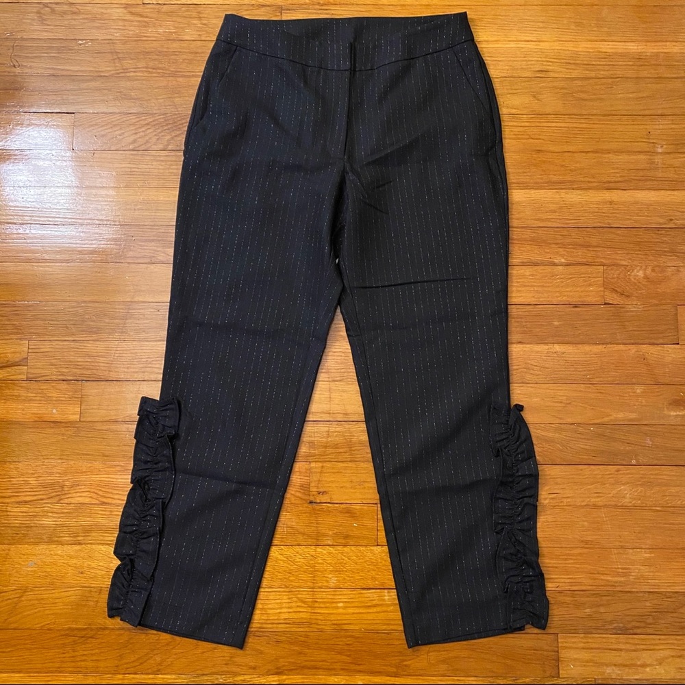 Blue sparkle pants with ruffles.